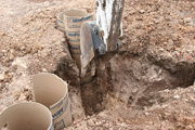 back hoe was used to clear top four feet of dirt from tri-pillar